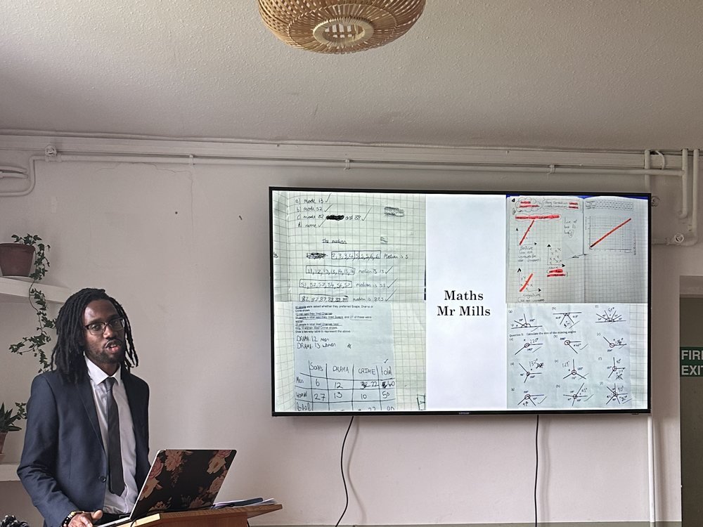 A member of staff presenting maths work on screen at the awards evening